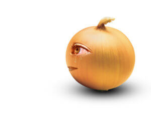 Onion illustration with tears coming out of its eyes