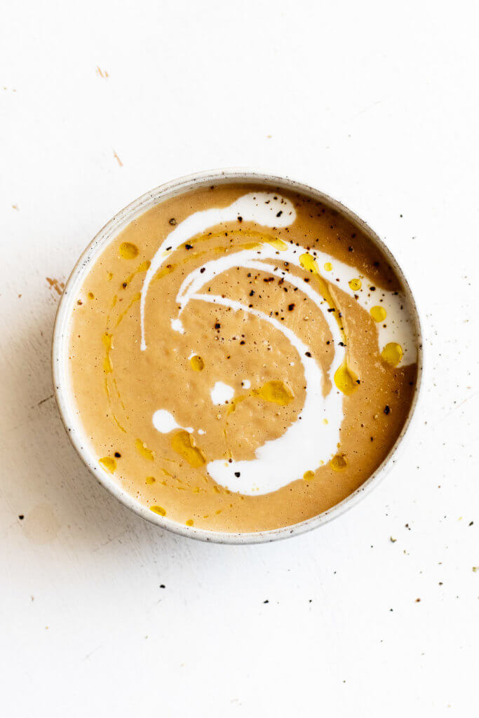Photo of Caramelized Onion and Corn Soup on white background
