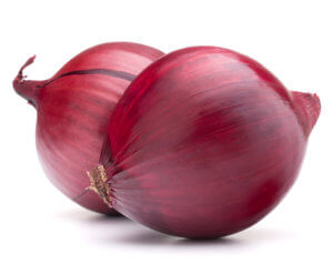 Two red onions with skins