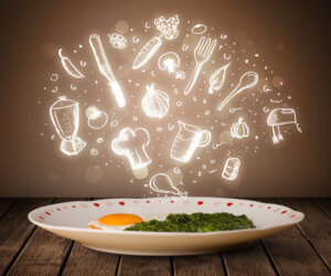 Plate of food with white kitchen icons on brown background