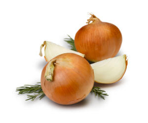 Yellow storage onions on white background