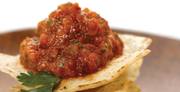 Charred Tomato and Onion Salsa on a tortilla chip