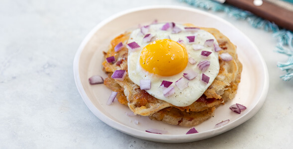 Savory Onion Pancakes with Bacon and Cheddar on white plate and white background